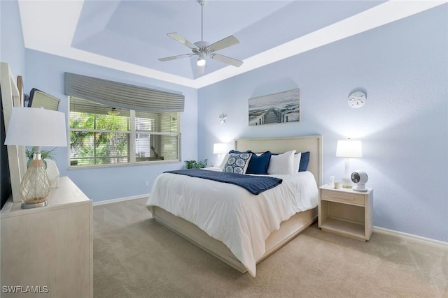 1118 Dorchester Ct, Naples, FL 34104 - bedroom featuring baseboards, a raised ceiling, and light carpet