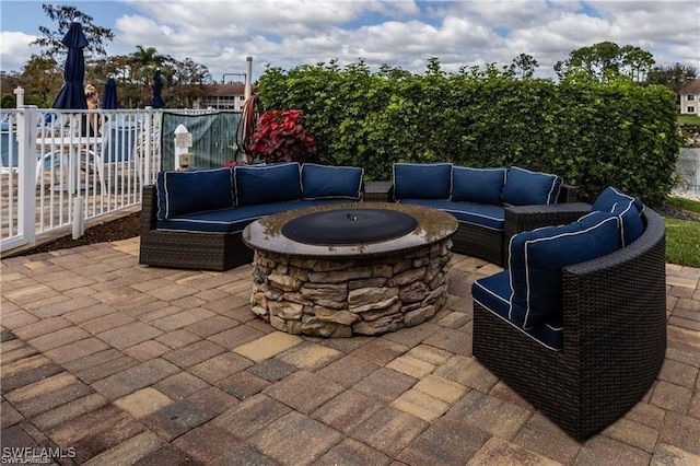 1118 Dorchester Ct, Naples, FL 34104 - view of patio featuring fence and an outdoor living space with a fire pit