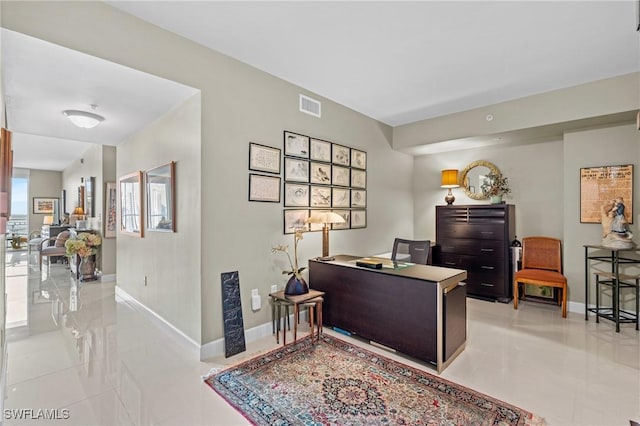 office space featuring visible vents and baseboards