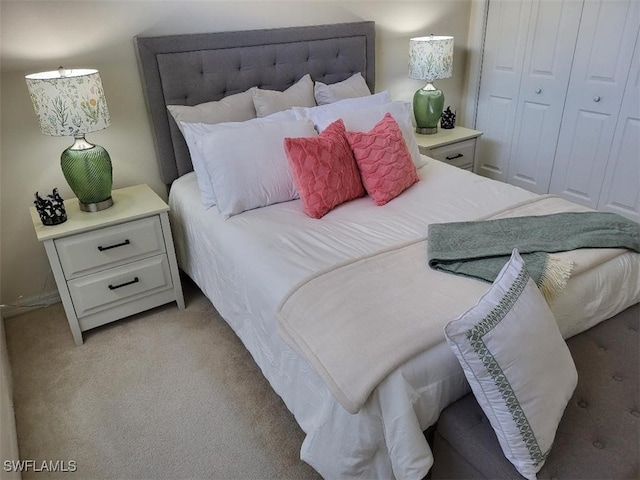 bedroom featuring light carpet