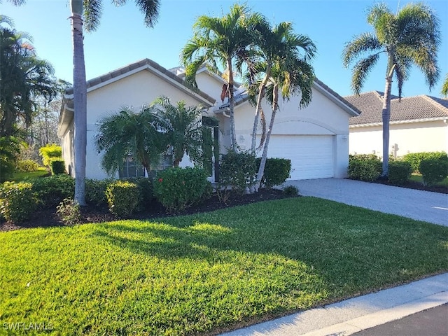 view of front of home featuring a garage and a front lawn