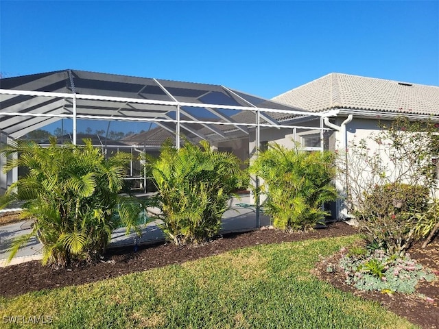 exterior space with a pool and a lanai