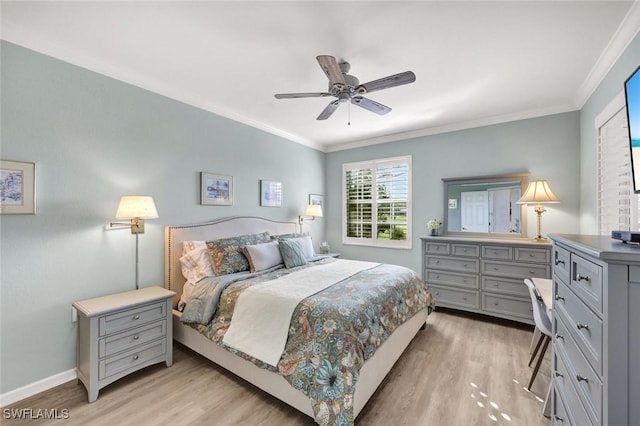 bedroom featuring light wood-style flooring, baseboards, and crown molding