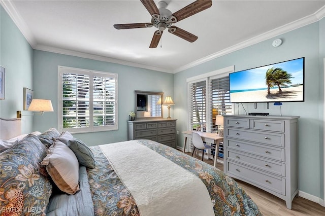 bedroom featuring baseboards, a ceiling fan, light wood-style flooring, and crown molding