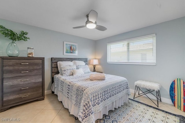 tiled bedroom with ceiling fan