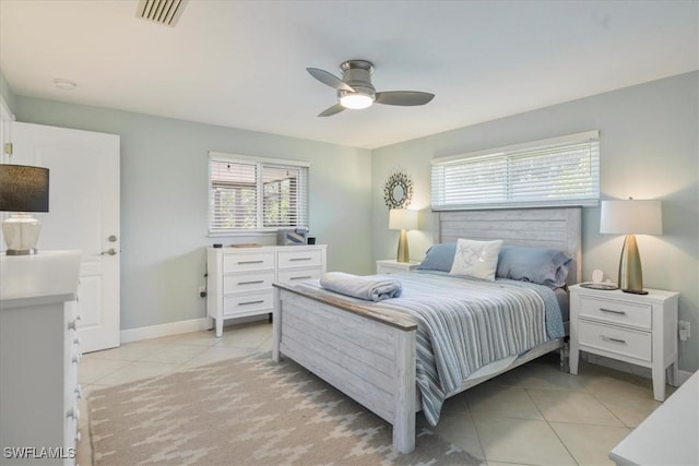 bedroom with light tile patterned floors and ceiling fan