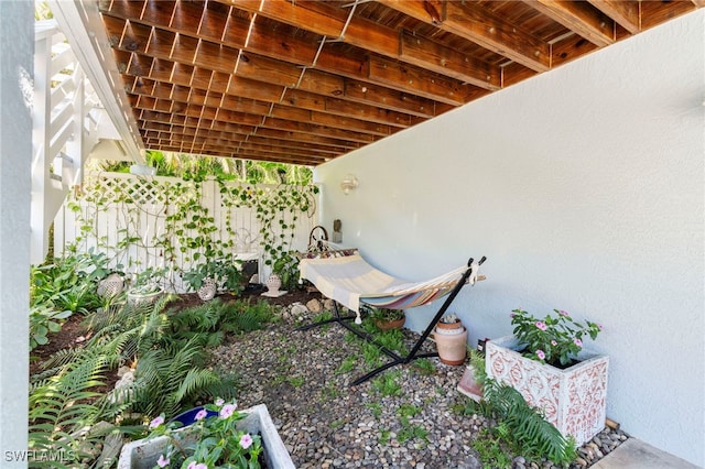 exterior details featuring fence and stucco siding