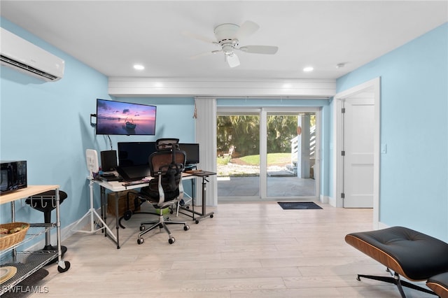 office space with recessed lighting, a wall unit AC, baseboards, and wood finished floors