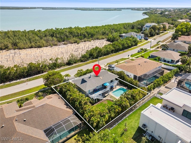 birds eye view of property featuring a water view