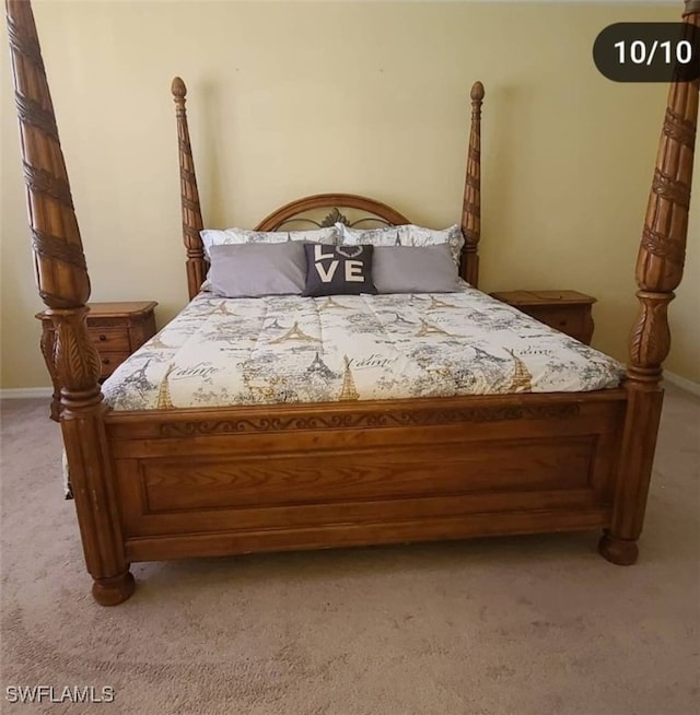 bedroom featuring light colored carpet