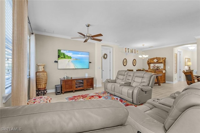 living room featuring crown molding, light hardwood / wood-style flooring, and ceiling fan with notable chandelier