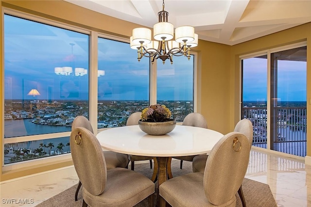 dining room featuring beamed ceiling, a water view, coffered ceiling, and a chandelier