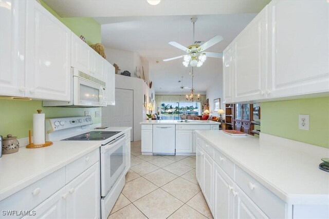 1060 Partridge Cir Unit 201, Naples, FL 34104 - kitchen featuring white cabinetry, ceiling fan with notable chandelier, light tile patterned floors, and white appliances