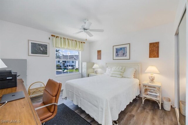 1060 Partridge Cir Unit 201, Naples, FL 34104 - bedroom featuring ceiling fan, dark hardwood / wood-style floors, and a closet