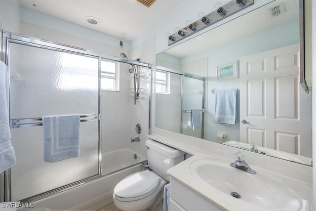 1060 Partridge Cir Unit 201, Naples, FL 34104 - full bathroom with enclosed tub / shower combo, vanity, and toilet