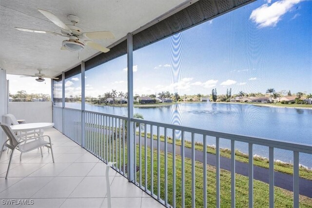 1060 Partridge Cir Unit 201, Naples, FL 34104 - balcony with a water view and ceiling fan