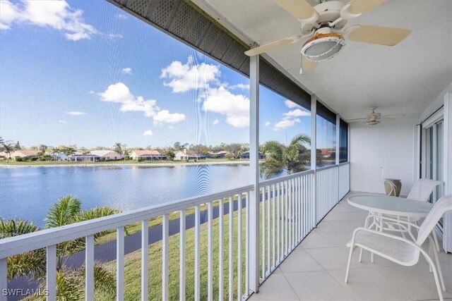 1060 Partridge Cir Unit 201, Naples, FL 34104 - balcony featuring ceiling fan and a water view