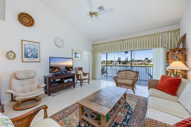 1060 Partridge Cir Unit 201, Naples, FL 34104 - living room featuring light tile patterned flooring, ceiling fan, and high vaulted ceiling