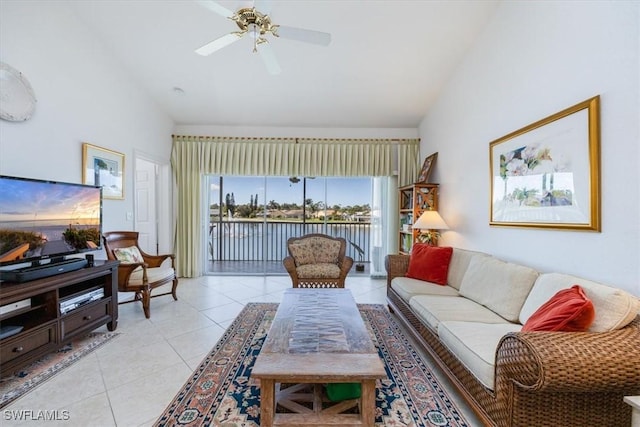 1060 Partridge Cir Unit 201, Naples, FL 34104 - tiled living room featuring vaulted ceiling and ceiling fan