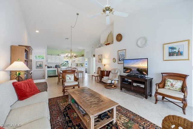 1060 Partridge Cir Unit 201, Naples, FL 34104 - living room featuring light tile patterned floors, ceiling fan with notable chandelier, and high vaulted ceiling