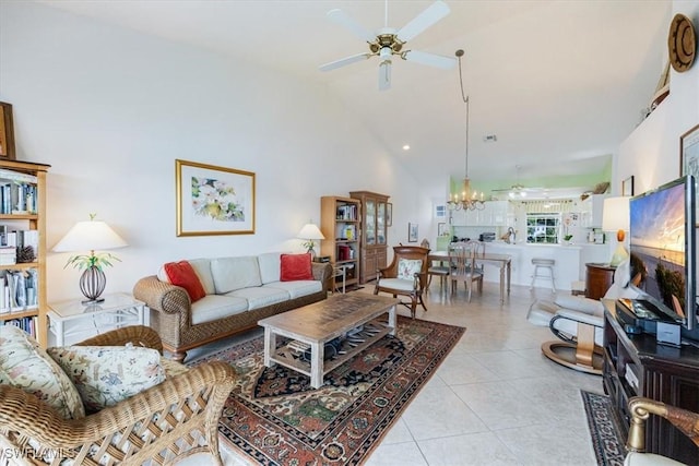 1060 Partridge Cir Unit 201, Naples, FL 34104 - tiled living room featuring ceiling fan with notable chandelier and high vaulted ceiling