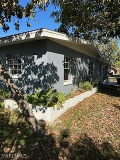 view of side of property with stucco siding