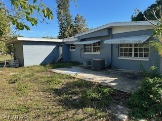 back of house with cooling unit