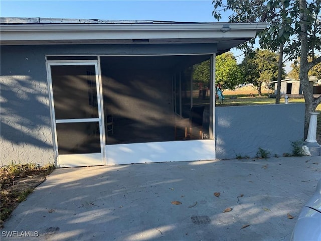 exterior space with a carport and concrete driveway