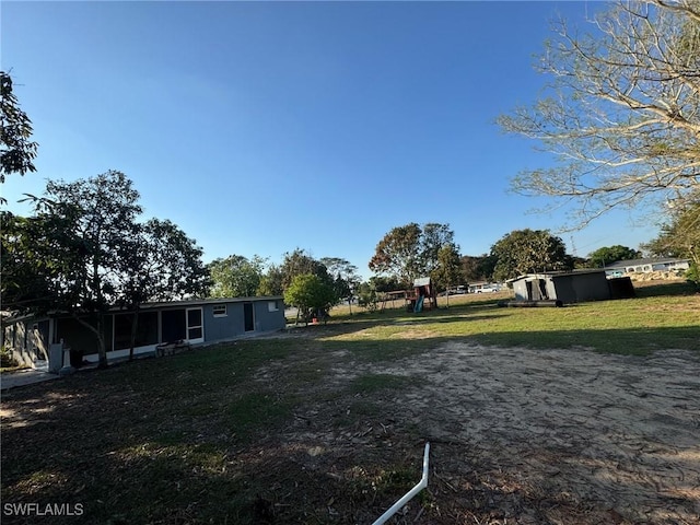 view of yard featuring playground community