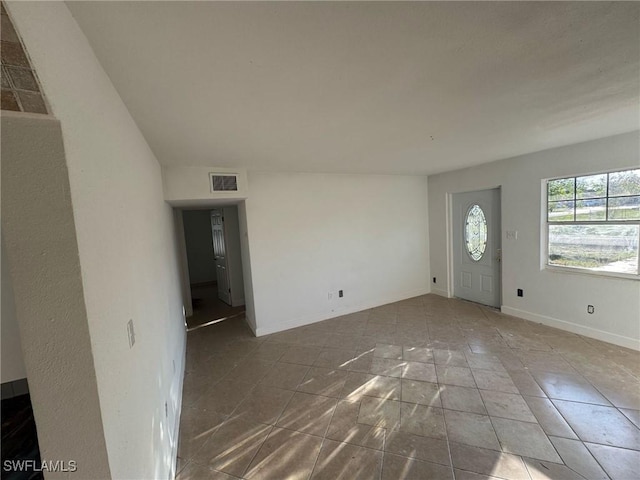 interior space featuring visible vents and baseboards