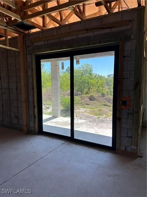 interior space with unfinished concrete flooring