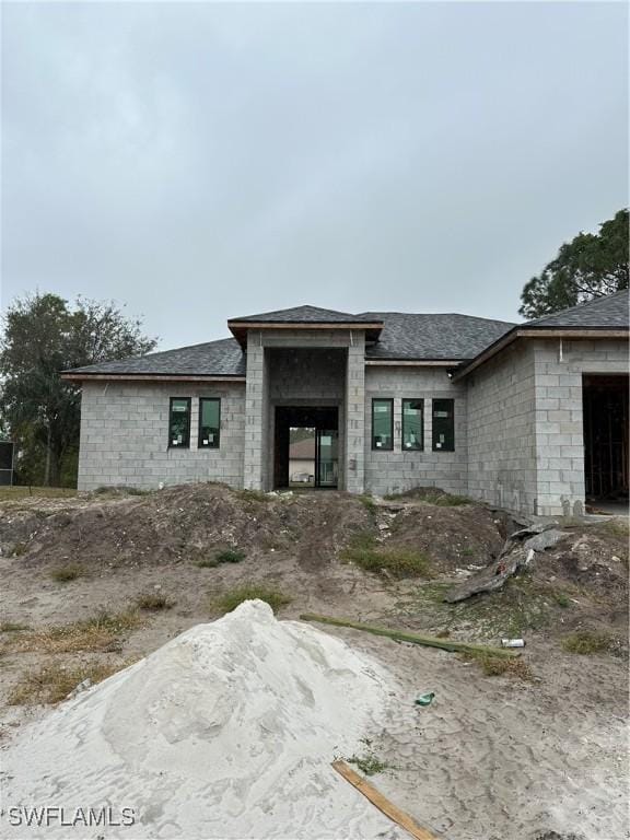 view of front of house featuring concrete block siding