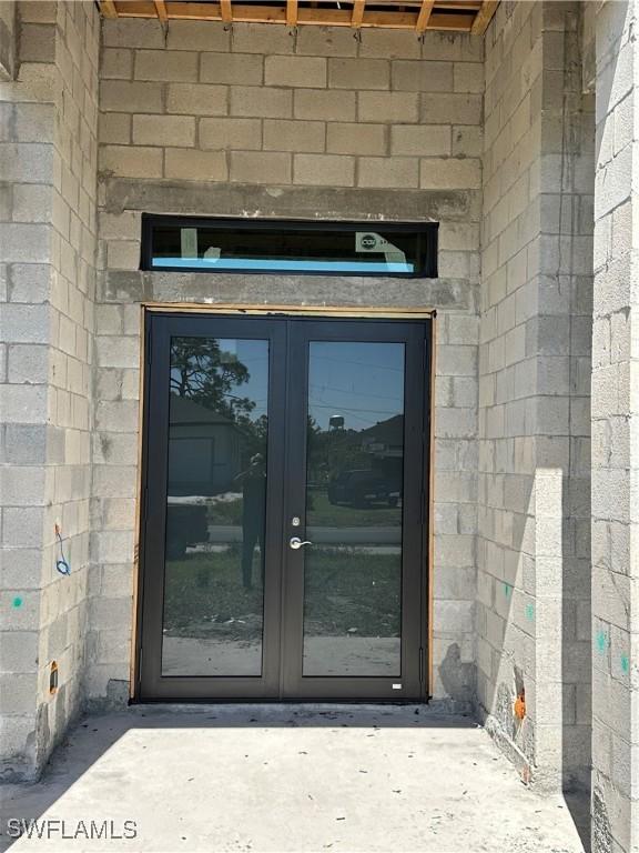 property entrance featuring french doors