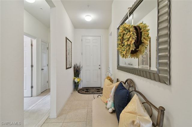 15011 Sandpiper Preserve Blvd Unit 106, Fort Myers, FL 33919 - hallway featuring light tile patterned floors and baseboards