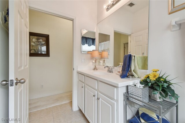 bathroom with vanity and tile patterned floors