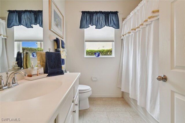 full bathroom featuring tile patterned flooring, vanity, shower / tub combo, and toilet