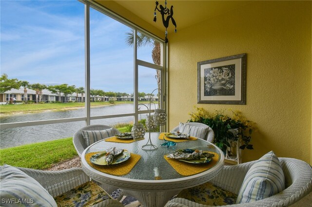 sunroom with a water view