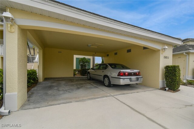 view of vehicle parking featuring a carport