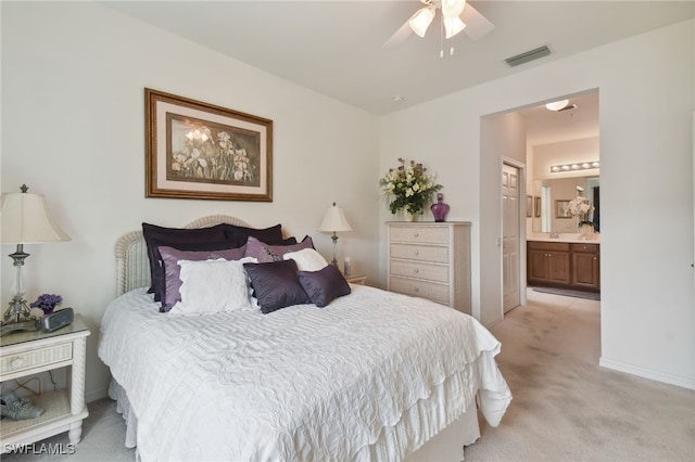 15011 Sandpiper Preserve Blvd Unit 106, Fort Myers, FL 33919 - bedroom featuring light carpet, ensuite bath, a ceiling fan, and baseboards