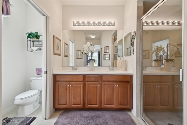 15011 Sandpiper Preserve Blvd Unit 106, Fort Myers, FL 33919 - full bathroom featuring double vanity, toilet, and tile patterned flooring