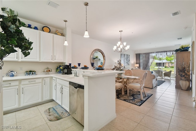 15011 Sandpiper Preserve Blvd Unit 106, Fort Myers, FL 33919 - kitchen with stainless steel dishwasher, light tile patterned floors, a chandelier, open floor plan, and a peninsula