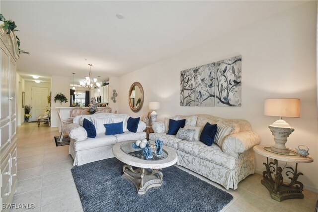 living room with an inviting chandelier and light tile patterned floors