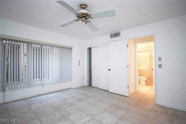 unfurnished bedroom with ceiling fan and a closet