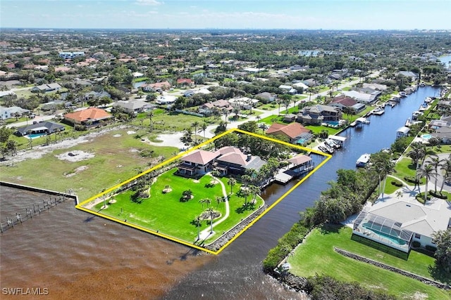 birds eye view of property featuring a water view