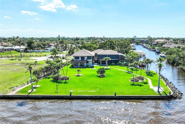 birds eye view of property with a water view