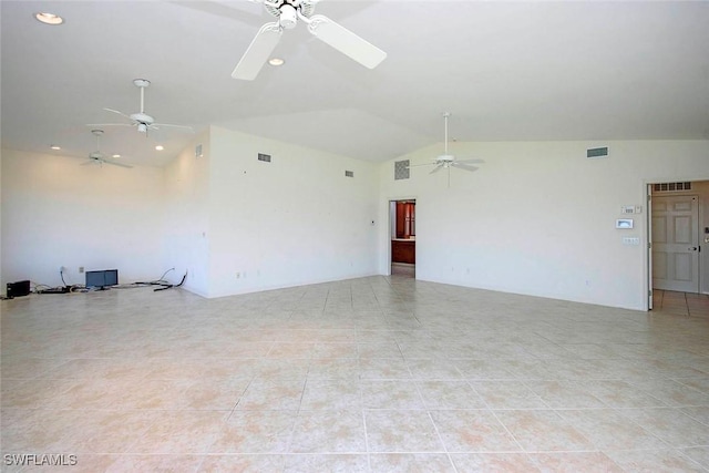 tiled empty room featuring ceiling fan and vaulted ceiling