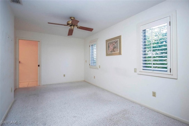 spare room with ceiling fan