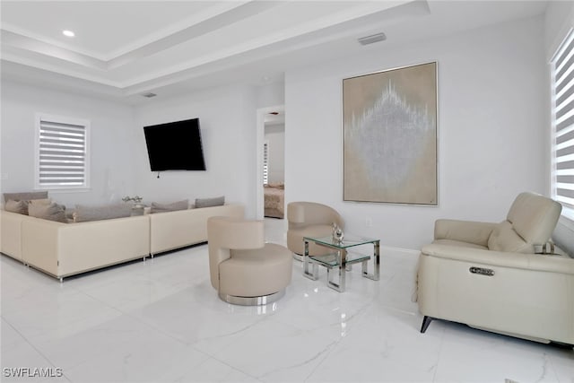 living area featuring marble finish floor, visible vents, a raised ceiling, and recessed lighting