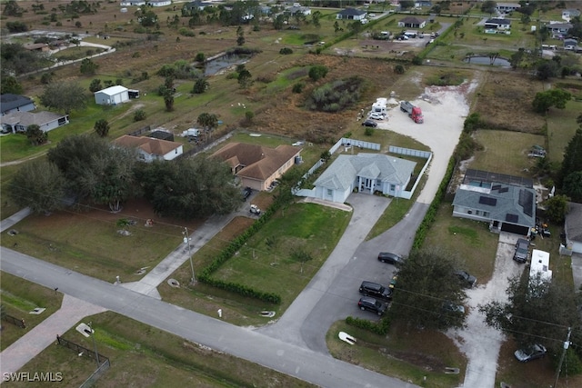 birds eye view of property with a residential view