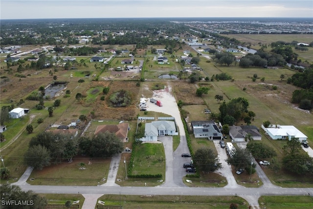 birds eye view of property with a residential view